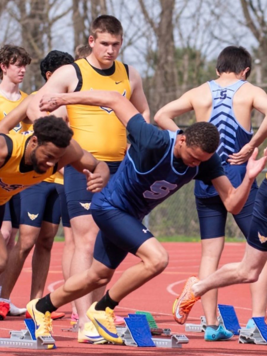 (Center) Freshman track runner Devonte Horton running 100m.
