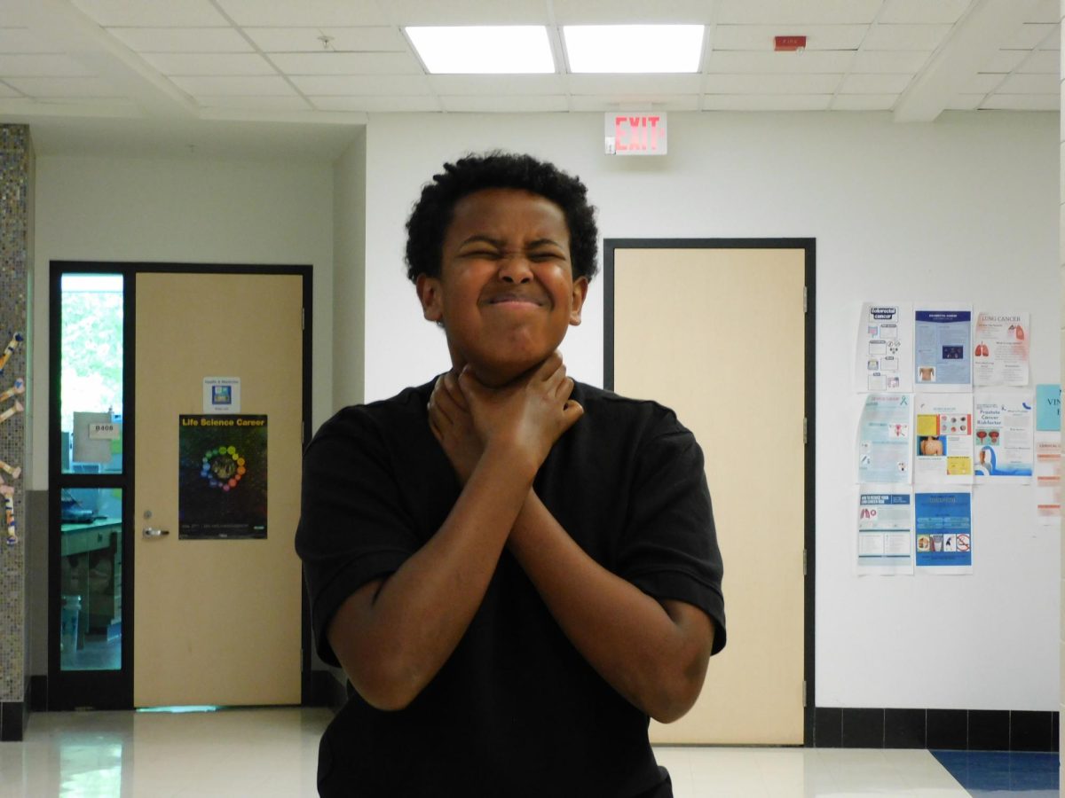 Skyline student Yonis Osman ('29) reacts after realizing AP season is over, but exams and assignments still continue during the final weeks of the school year.