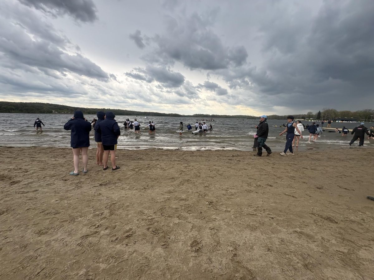 Dark storm clouds roll over the course as Skyline athletes help crews safely return to shore during an emergency evacuation at the Midwest Rowing Championships. The evacuation followed severe weather that interrupted racing Saturday afternoon.

